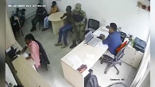 Policeman shoots bank manager. Uganda. Video.