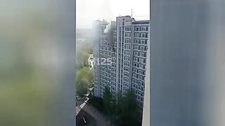 A man jumps from the window of a burning building. Moscow