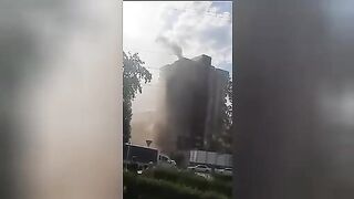 People jump out of windows and throw out children during a fire