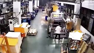 Worker wrapped around the machine. Video.