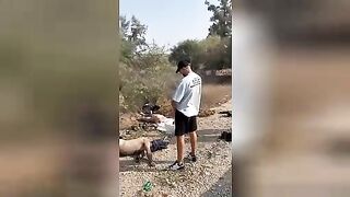 An Israeli man urinates on the corpses of Palestinian militants