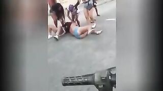 Fat woman crap during a street fight. Video.