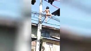 Young tightrope walker demonstrates striptease