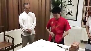 Chinese man breaks bricks with his cock Video.