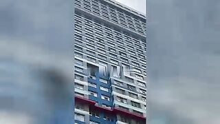 A naked man with a knife jumped from the 26th floor