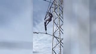 Suicide on a high voltage mast. Video.