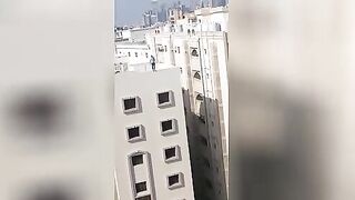 Suicidal jump from the roof of a building. Video. Qatar.