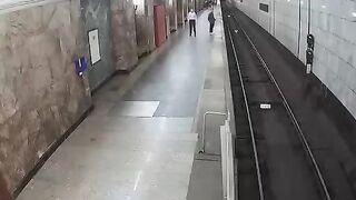 Man throws himself under a subway train. Moscow, Russia.