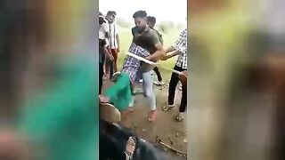 Hindu being beaten with a stick on his bare ass. Video ?