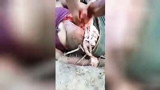 Gutting the body of a young girl. Video. Colombia