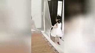 Little girl being beaten with a stick. Video. China