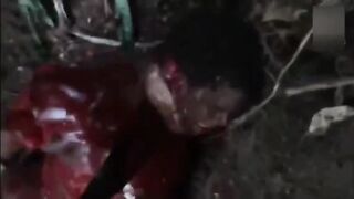 Hands cut off and guts gutted. Video.