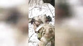 A Ukrainian soldier kills a Russian POW with several shots to the head.