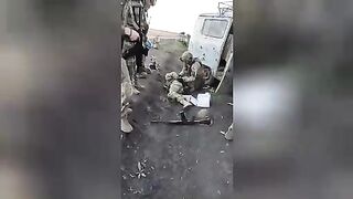 Ukrainian military take a Russian soldier prisoner