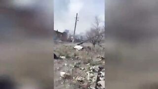 Chechen fighters collect weapons from corpses.