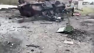 Corpses of Russian soldiers near the burnt APC. Video.