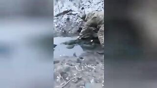 Ukrainian military searches the corpses of Russian soldiers