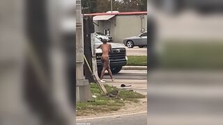 Crazy Bald Black Woman Naked in Traffic