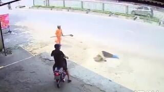 Woman Cleaning The Road Knocked Out By Truck