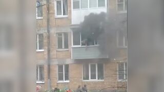 Woman Jumps Out Of The Burning Building