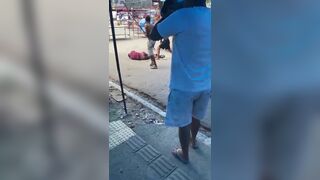 Thief Clubbed With Long Sticks By Vendors In Brazil