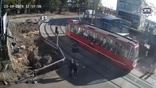 Careless Couple Knocked Out By Tram In Poland