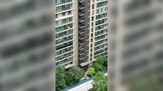 Man Jumps From A Tall Building In China