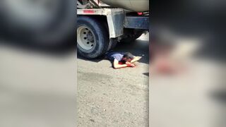 Man Crushed By Truck, Still Alive